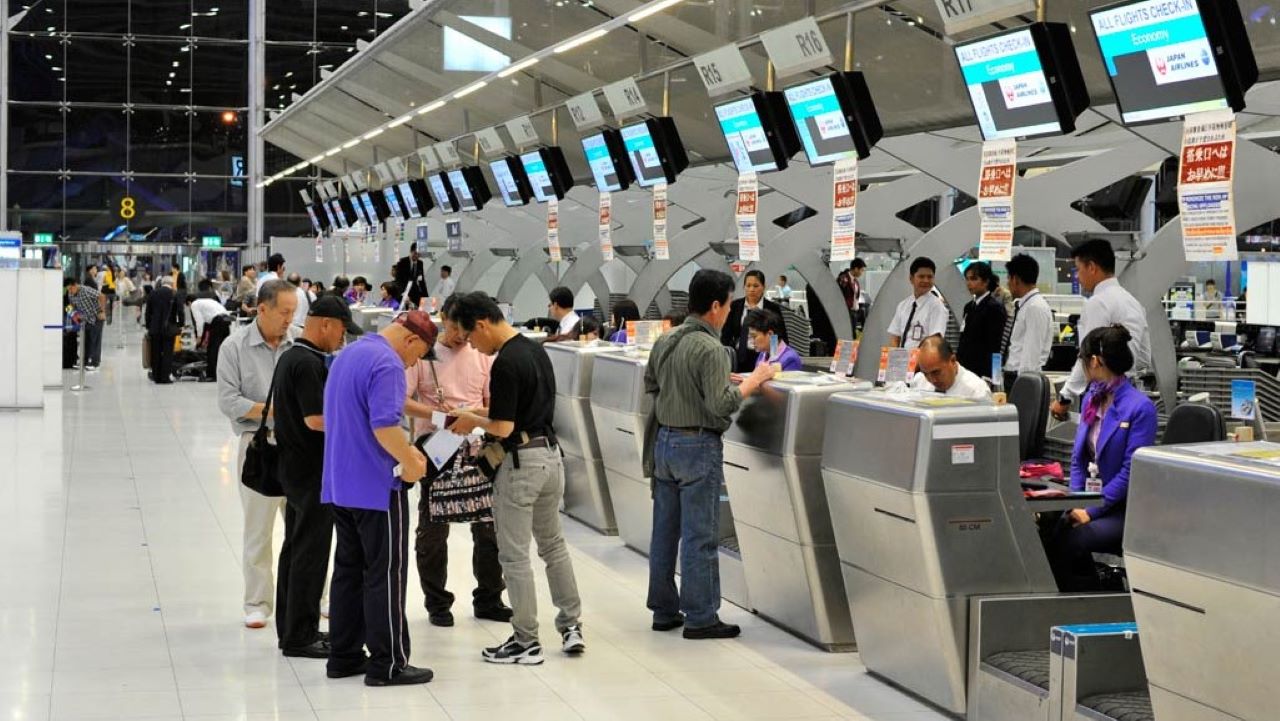 Airport Counter Staff assisting passengers at Dubai International Airport